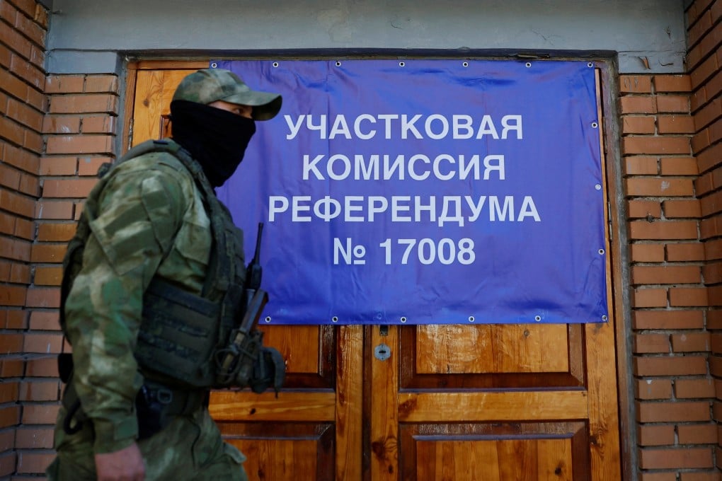 A service member of the self-proclaimed Donetsk People’s Republic at a polling station in Donetsk, Ukraine. Photo: Reuters