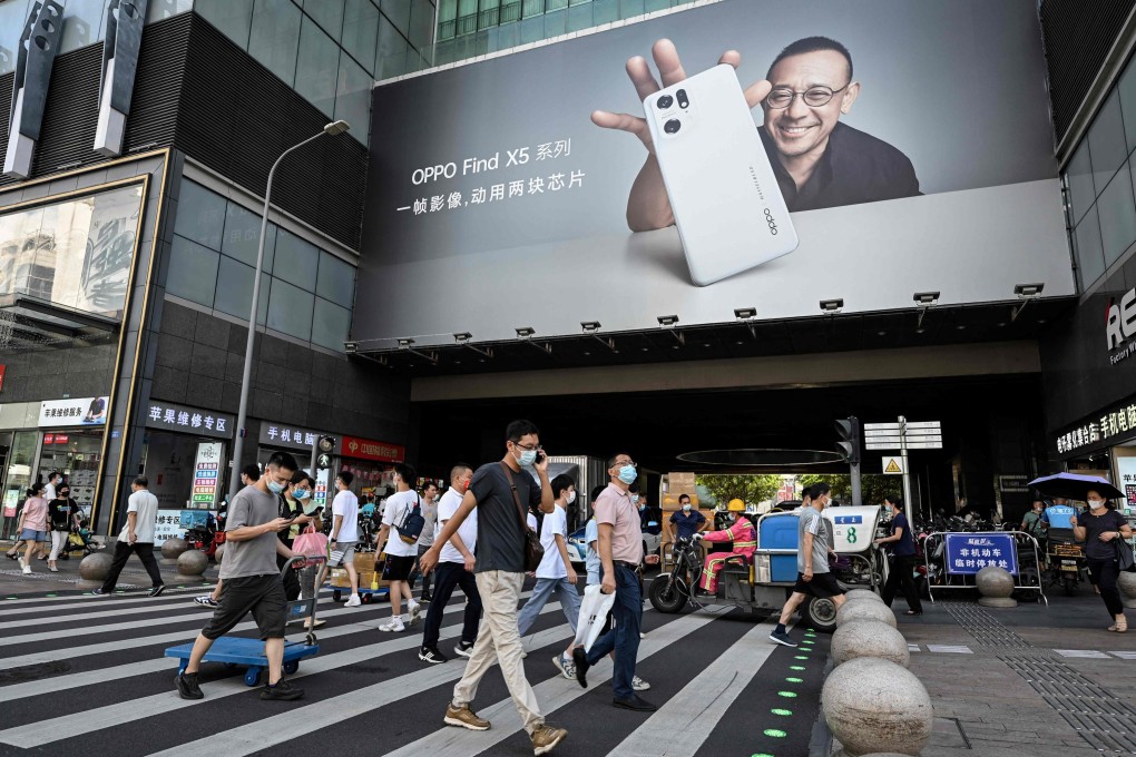 This photo taken on July 12, 2022 shows people walk along Huaqiangbei Commercial Street in Shenzhen, in China’s southern Guangdong province. Photo: AFP