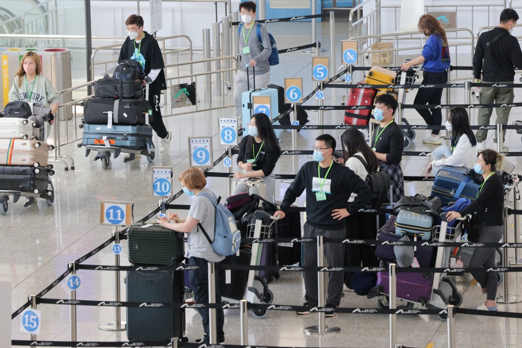 Passengers line up at a quarantine processing area  in the arrivals hall at Hong Kong International Airport on Wednesday.  Photo: Jelly Tse