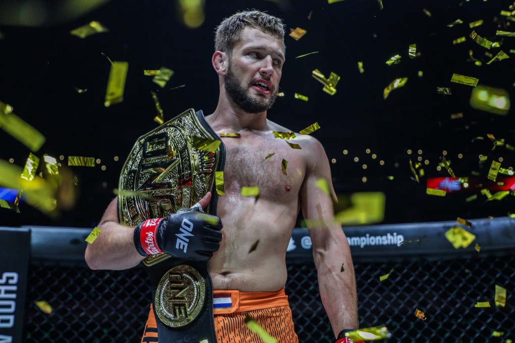 Reinier de Ridder celebrates with his ONE middleweight MMA title after submitting Vitaly Bigdash at ONE 159 in Singapore. Photos: ONE Championship