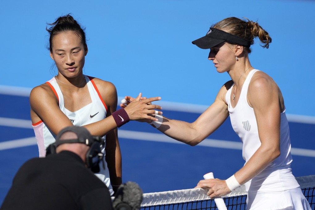 Liudmila Samsonova (right) of Russia and Zheng Qinwen of China join hands at the end of their final at the Pan Pacific Open tennis tournament in Tokyo. Photo: EPA-EFE