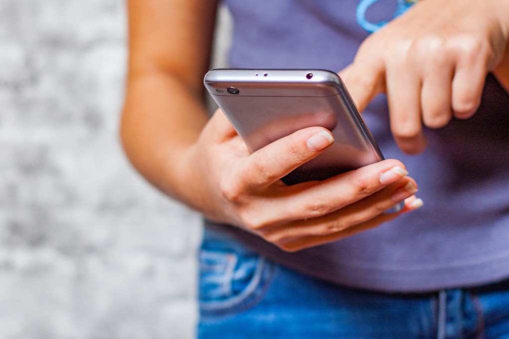 Most schools in Hong Kong have rules on mobile phone use, with some even banning smartphones. But such rules may be out of step with reality. Photo: TNS