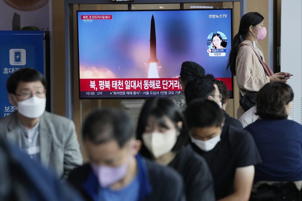 Passengers pass through Seoul Railway Station in Seoul, South Korea, on Sunday, amid reports of North Korea fired a short-range ballistic missile. Photo: AP