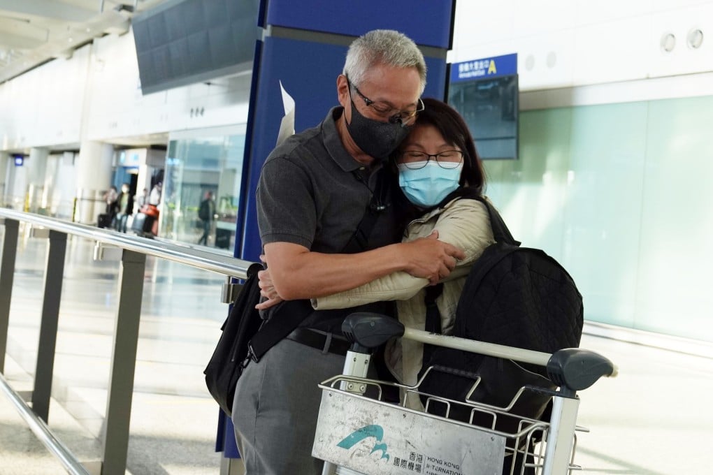 A traveller hugs a loved one after being among the first in Hong Kong to arrive without having to serve quarantine. Photo: Sam Tsang