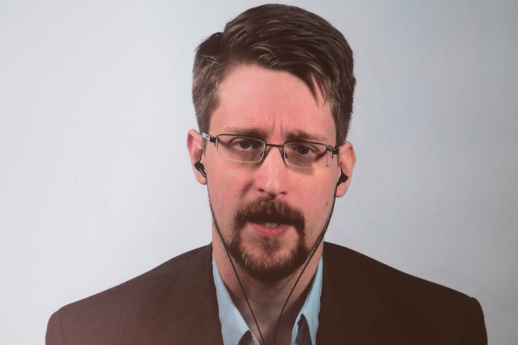 US whistle-blower Edward Snowden is seen on a screen as he speaks during a video conference in Berlin in September 2019. Photo: TNS