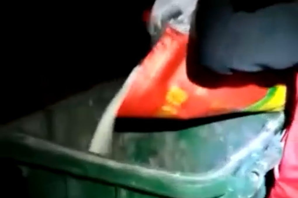 Jiao district epidemic control command centre says a video that went viral of rice and eggs being dumped was shot by Hongqi Street community staff who found some residents “did not follow the prevention and control requirements”. The workers have since been “seriously criticised and educated”. Photo: Weibo