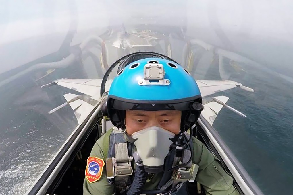 A PLA Navy pilot in a J-15 takes to the skies after leaving the deck of the aircraft carrier Liaoning. Photo: Handout