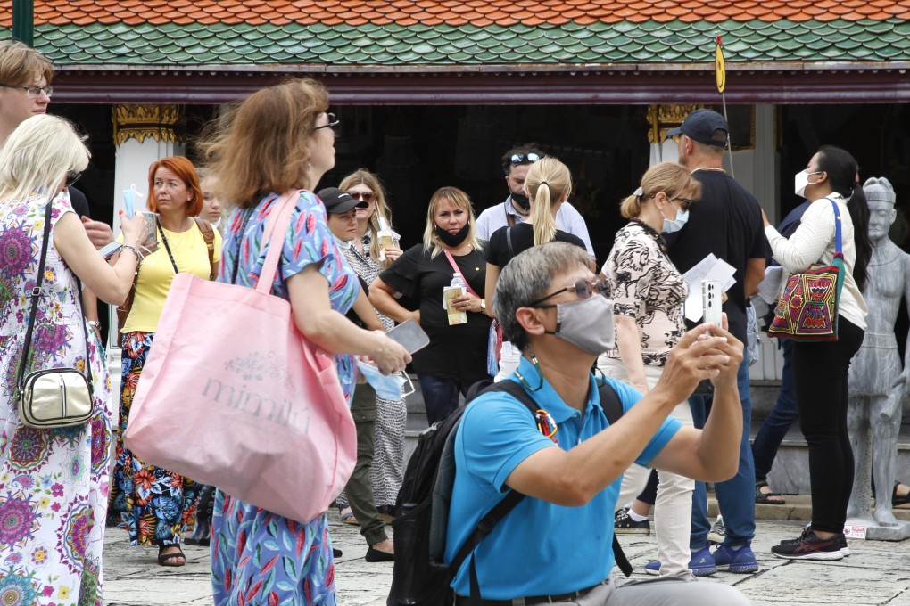 Tourists visit the Emerald Buddha Temple inside the Grand Palace in Bangkok, Thailand. Photo: EPA-EFE
