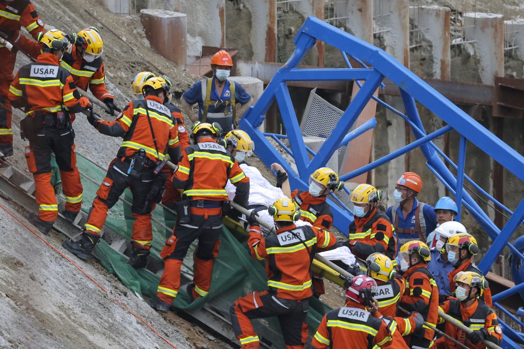Firemen pull a worker from the debris on September 7, following the collapse of a tower crane at a public housing construction site in Sau Mau Ping. The maximum penalty for those found guilty of occupational safety and health offences should be raised. Photo: Jelly Tse