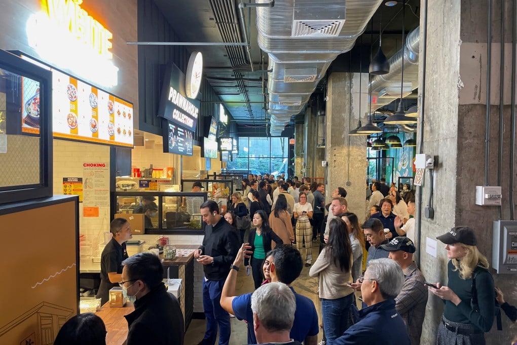 People queue at Urban Hawker, a Singapore-style hawker market, as it opens in Midtown Manhattan, in New York on Wednesday. Photo: Reuters