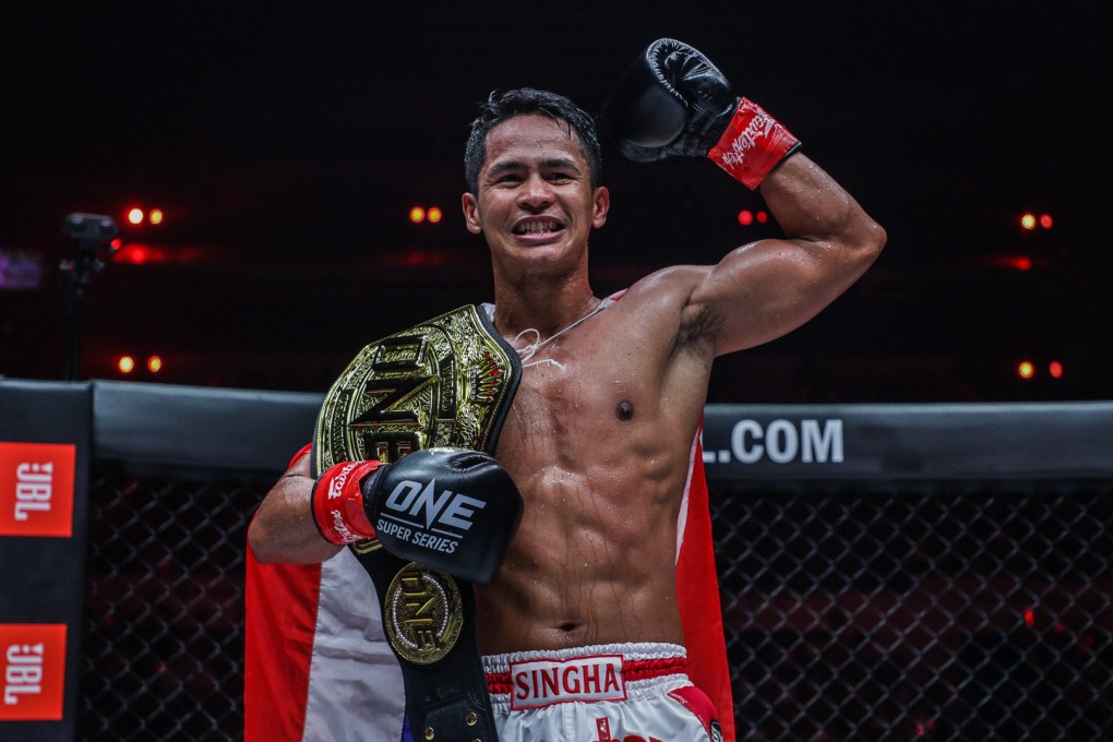 Superbon celebrates after beating Marat Grigorian to retain his featherweight kickboxing title at ONE X in Singapore. Photos: ONE Championship