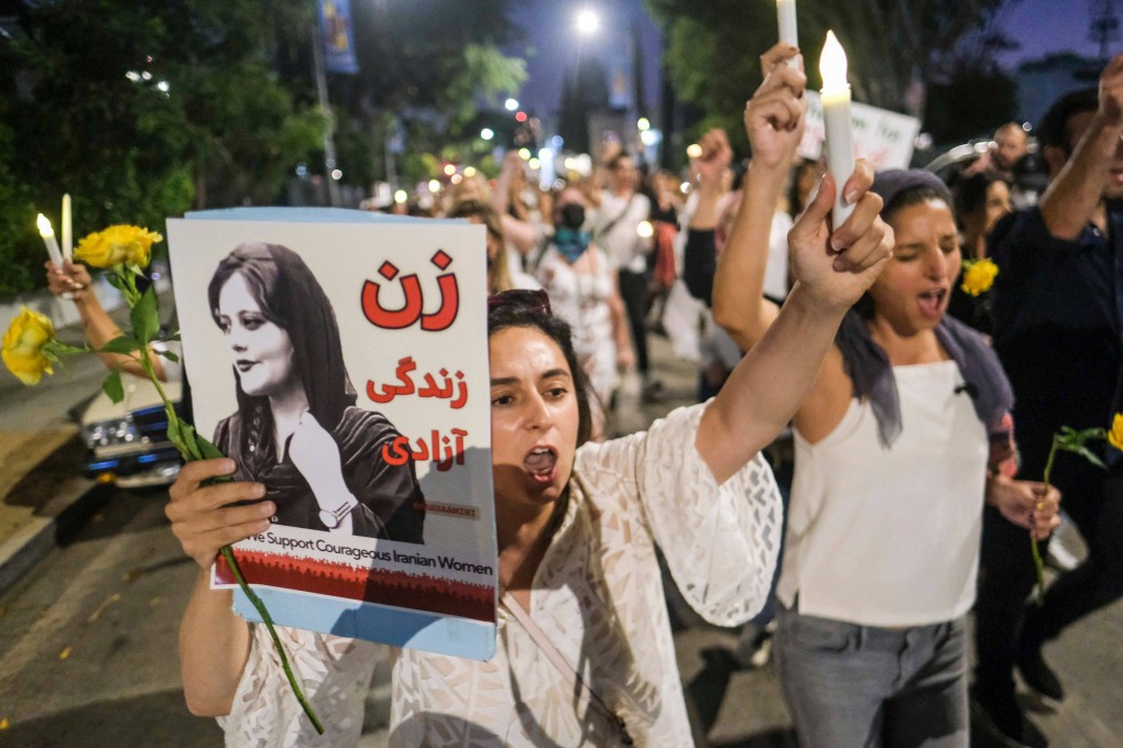 People in California march during a candlelight vigil for Mahsa Amini. Photo: AFP