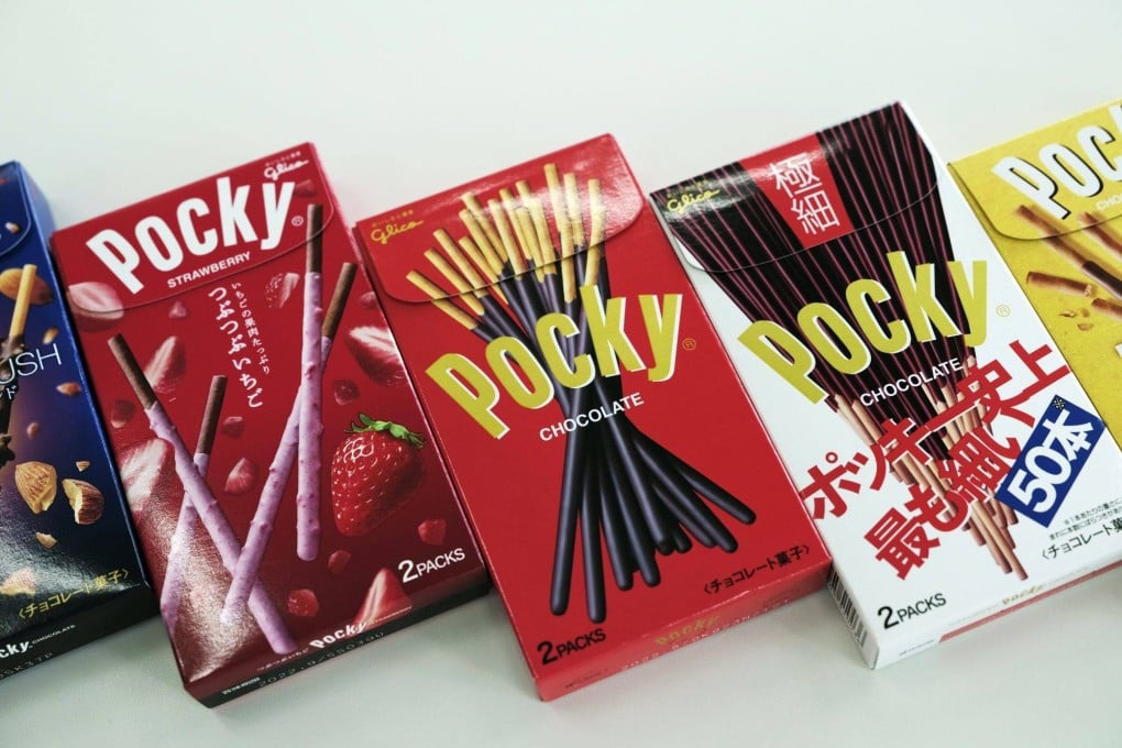 Boxes of Glico’s Pocky chocolate sticks at the company’s office in Osaka, Japan. The Japanese food giant wants to shed its unhealthy image and has brought in AI to help, but will it succeed? Photo: Bloomberg