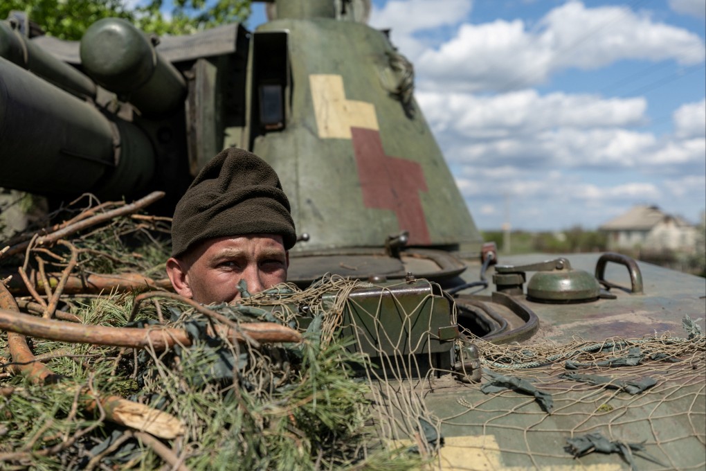 An Ukrainian soldier looks out from an armoured vehicle at Lyman, in the Donetsk region, in April. Photo: Reuters