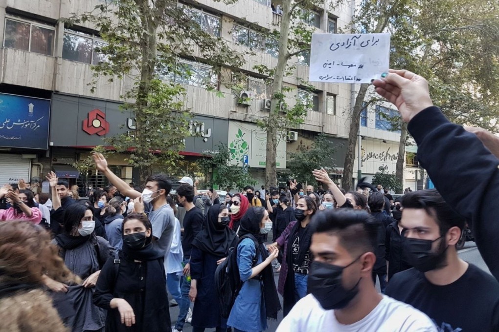 Protesters block a road during a protest over the death of young Iranian woman Mahsa Amini, who died last week after being arrested in Tehran for not wearing her hijab appropriately, in Tehran, Iran on Saturday. Photo: EPA-EFE/STR