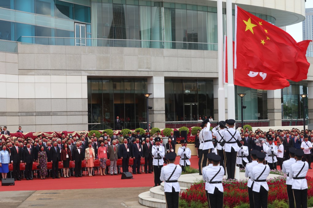 Chief Executive John Lee attends a flag-raising ceremony at Golden Bauhinia Square to celebrate National Day. Photo: Dickson Lee