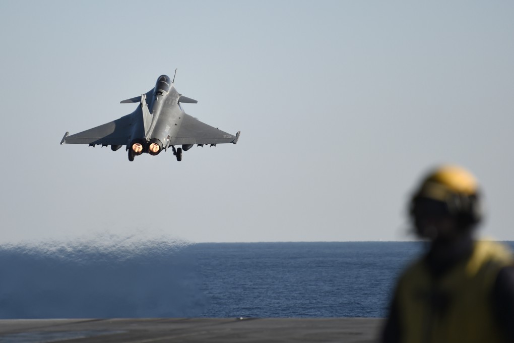 A French Rafale jet fighter takes off from France’s aircraft carrier Charles-de-Gaulle. Photo: AP