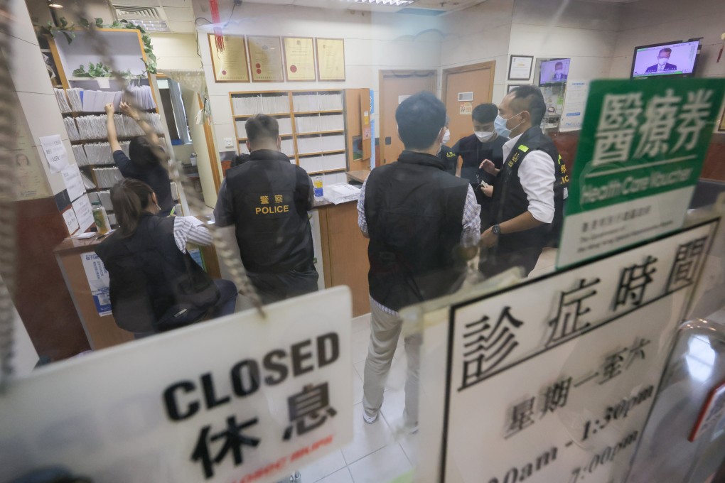 Police officers investigate a clinic in Chai Wan on September 22 for illegally issuing fake Covid-19 vaccination exemption certificates. Photo: Jelly Tse
