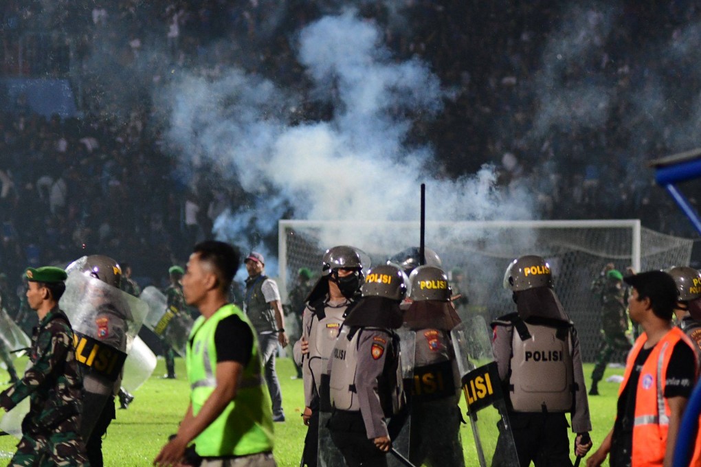 Tear gas let off by police is seen after a football match in East Java on October 1, 2022. Photo: AFP