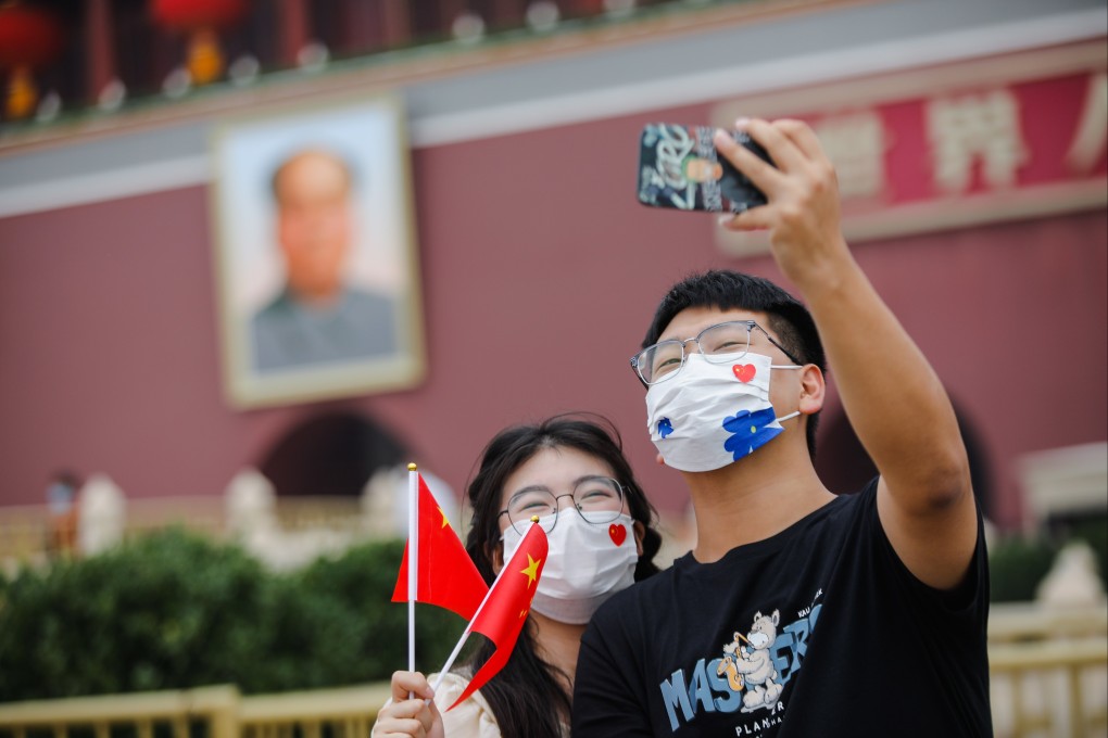Two people posing for a photo last week in Beijing’s Tiananmen Square. China’s leadership holds its 20th Party Congress in the capital in mid-October. Photo: EPA-EFE