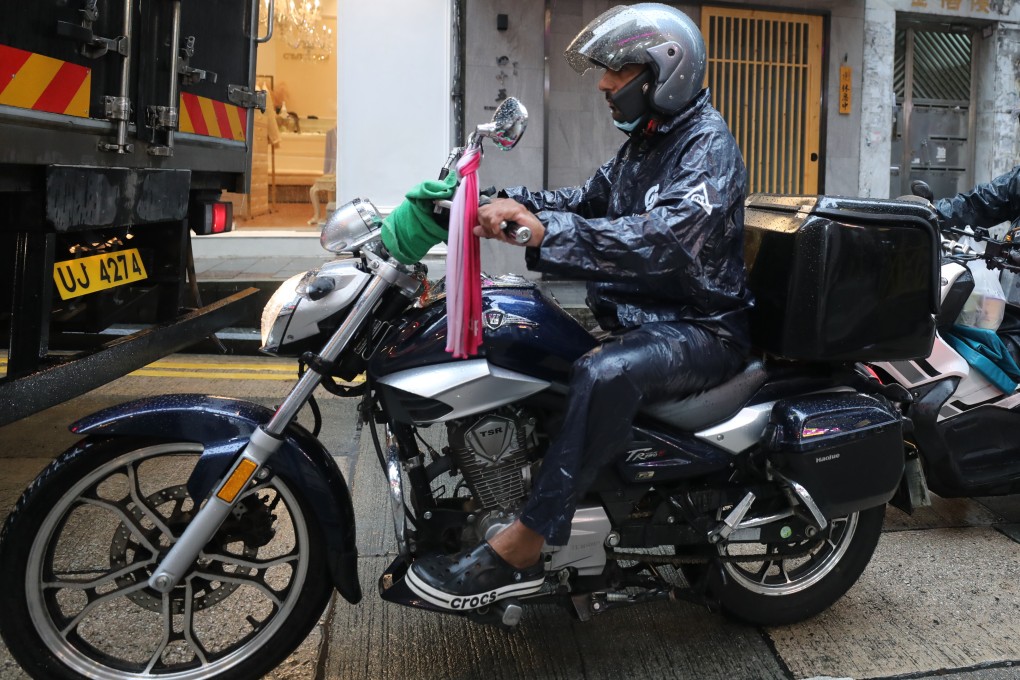 A delivery driver in Central on September 30. Around half of food delivery couriers from ethnic minority groups have said they experienced discrimination while working, according to a recent poll. Photo: Xiaomei Chen