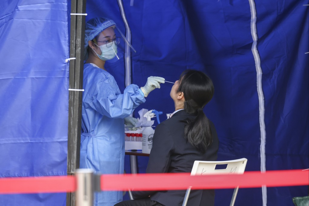 A woman gets a PCR test at a mobile centre set up at Victoria Park in Causeway Bay. Photo:  Dickson Lee.