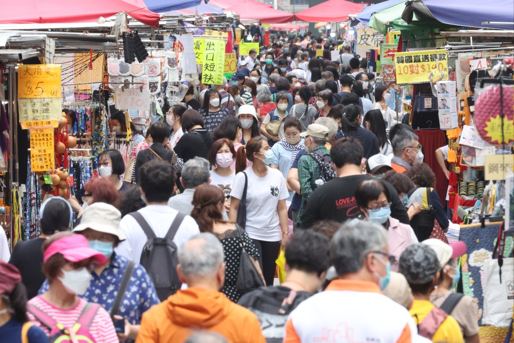People visit a street market in Mong Kok on April 22, a day after some social distancing rules are eased. Photo: Edmond So