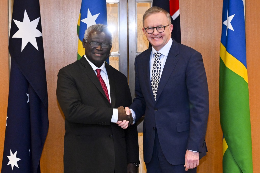 Australian Prime Minister Anthony Albanese, right, and Solomon Islands Prime Minister Manasseh Sogavare shake hands ahead of a bilateral meeting at Parliament House in Canberra, Australia. Photo: AP