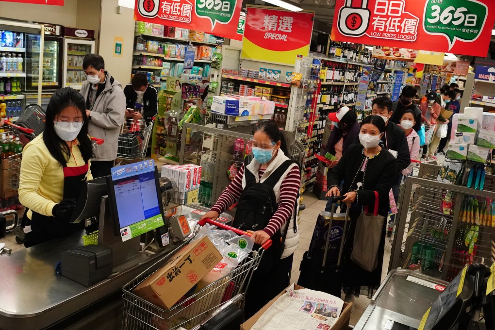 People queue up to check out food from supermarket in Sham Shui Po in February. Photo: Felix Wong