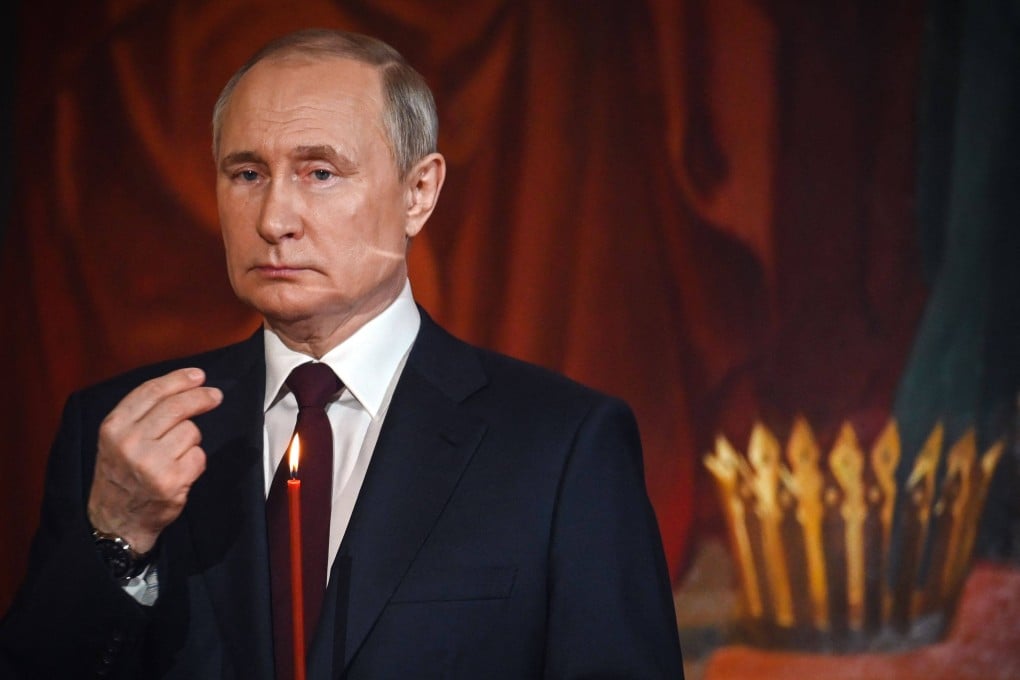 Russian President Vladimir Putin crosses himself during an Orthodox service in Moscow. Photo: AFP