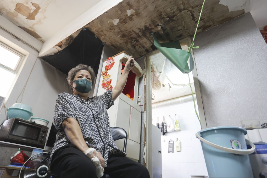 Ng, a resident in the area, points at the damage in her flat on Ming Lun Street in To Kwa Wan. Photo: Edmond So
