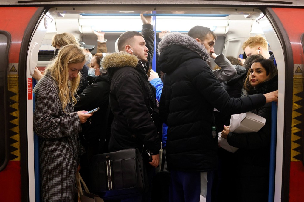 Commuters crowd onto a tube train in London in February.  British officials last week warned that renewed circulation of flu and a resurgence in Covid-19 could pile pressure on the National Health Service. File photo: AFP
