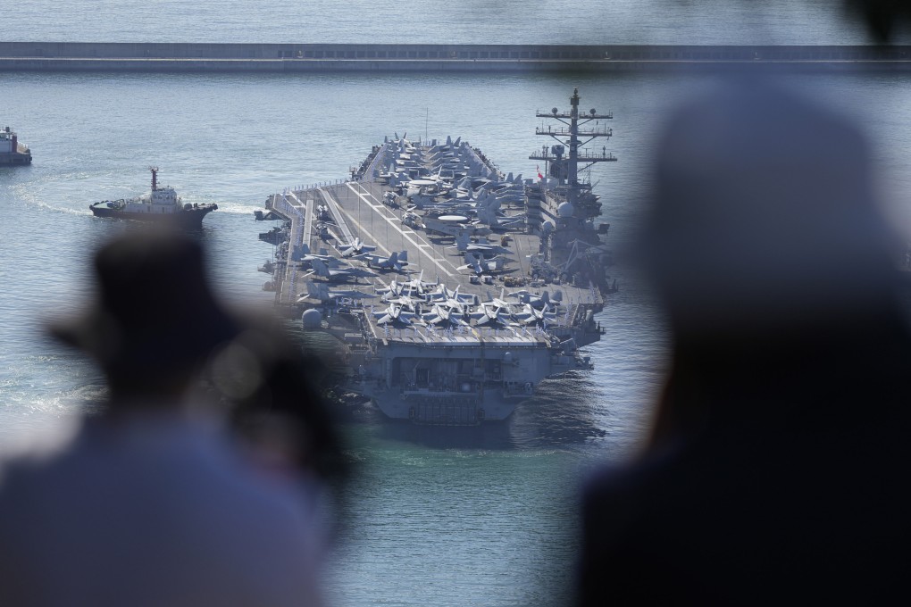 USS Ronald Reagan is escorted as it arrives in Busan, South Korea on September 23. North Korea warned on October 8 that the US redeployment of an aircraft carrier near the Korean Peninsula is causing a “considerably huge negative splash” in regional security, as it defended its recent missile tests as a “righteous reaction” to intimidating military drills between its rivals. Photo: AP