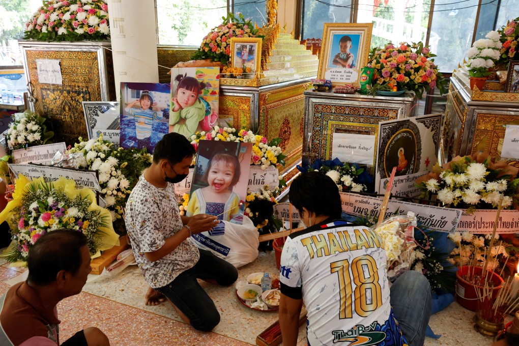 People pray at a temple following the mass shooting in Nong Bua Lam Phu province, Thailand. Photo: Reuters