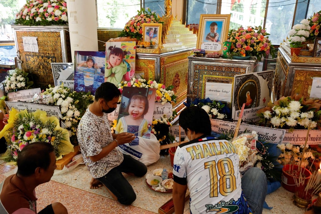 People pray at a temple following the mass shooting in Nong Bua Lam Phu province, Thailand. Photo: Reuters