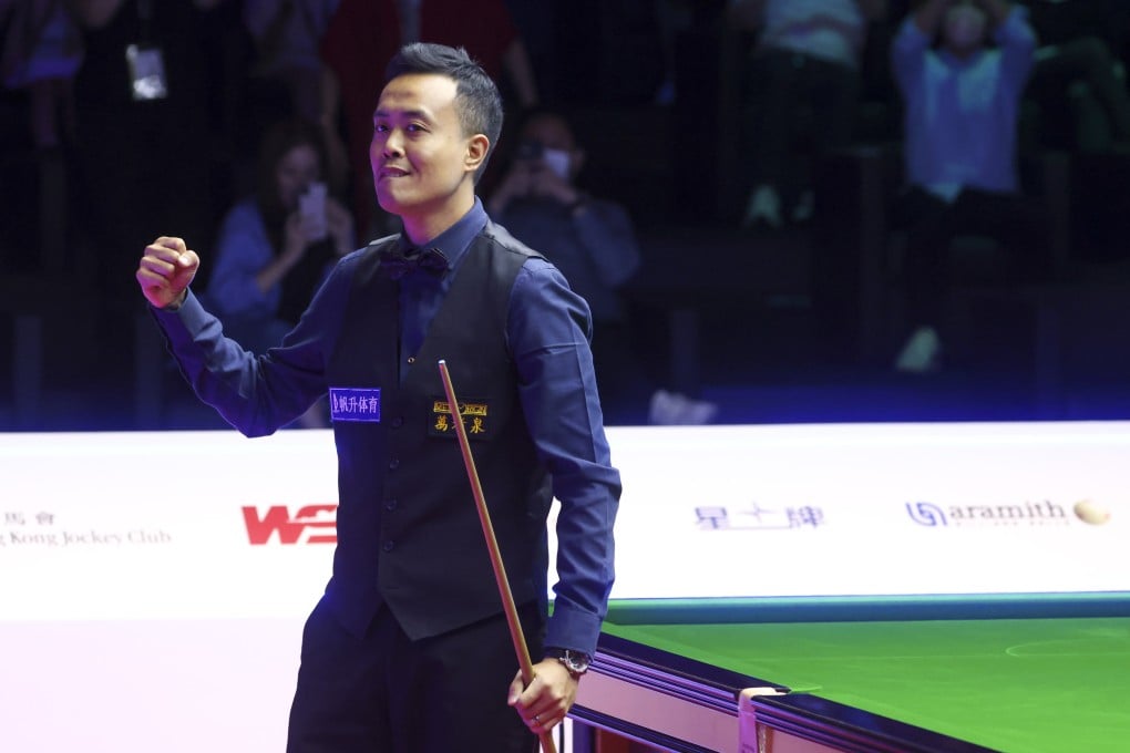 Marco Fu brings the Hong Kong Coliseum crowd to their feet as he completes his match-winning 147 break. Photo: Dickson Lee