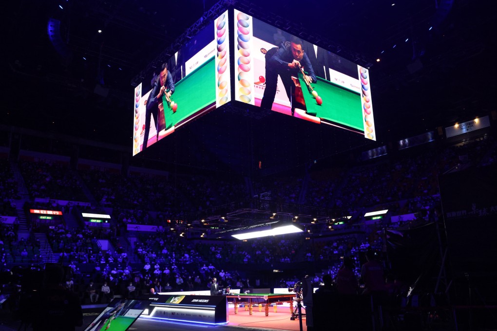Marco Fu plays a shot in a packed Hong Kong Coliseum, whose atmosphere won over the players. Photo: Dickson Lee
