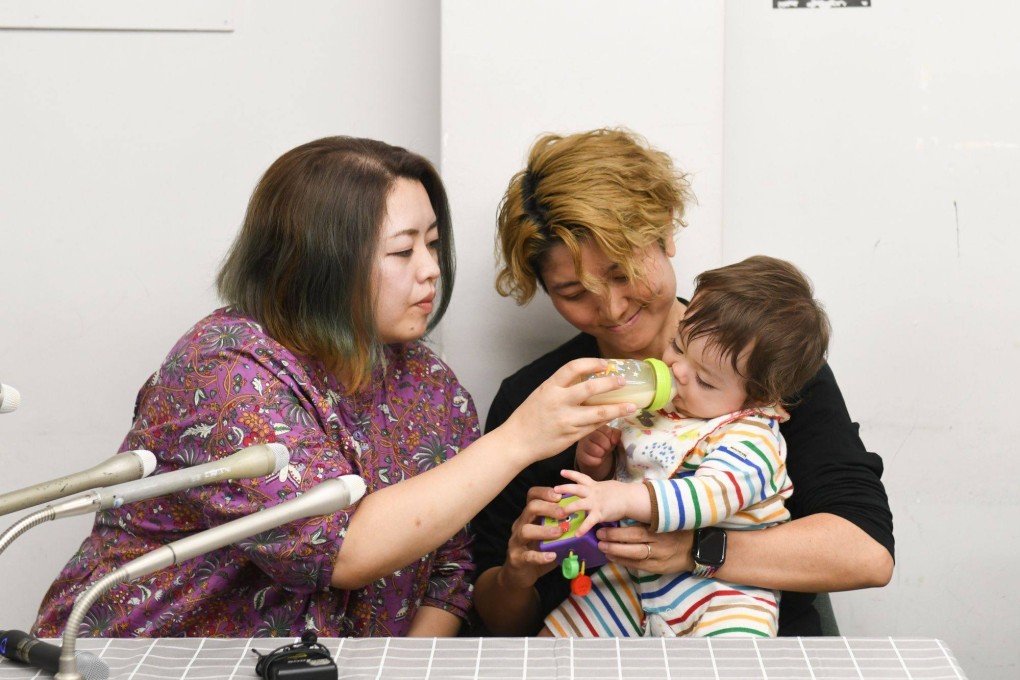 Satoko Nagamura, left, Mamiko Moda and their child at a press conference in Tokyo on Tuesday, when a system to register same-sex partnerships opened for applications. Photo: Bloomberg