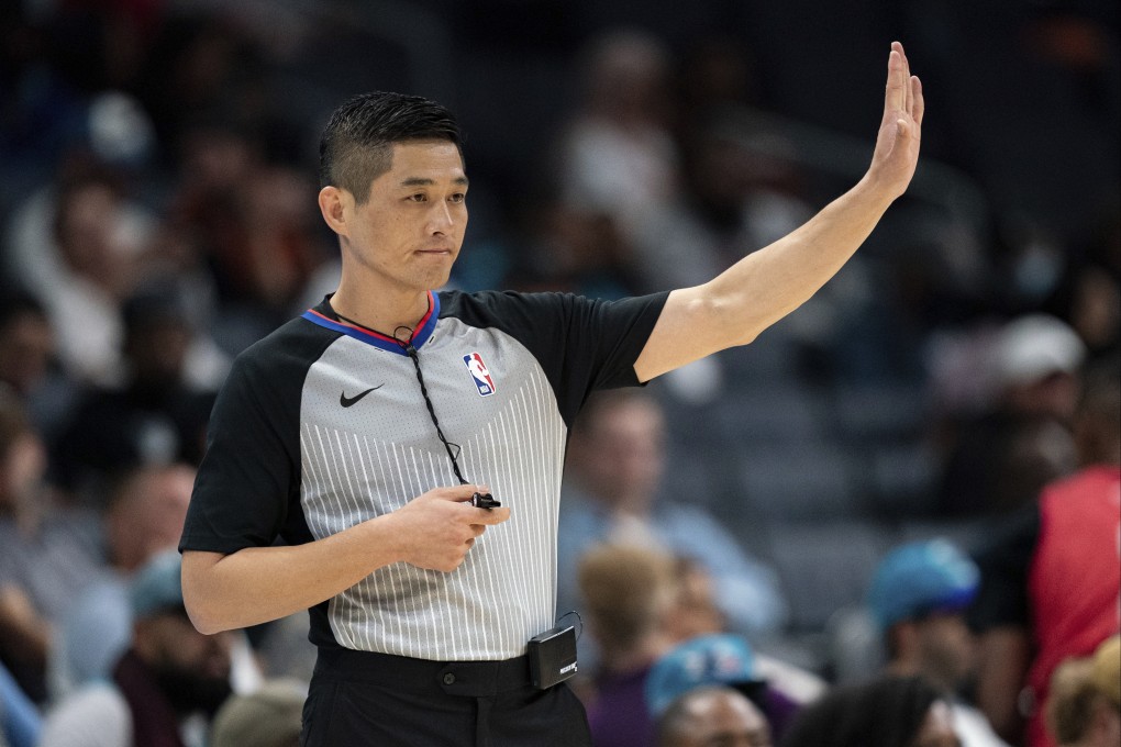 Referee Hwang Intae signals in the first half of an NBA preseason basketball game between the Charlotte Hornets and the Washington Wizards.Photo: AP