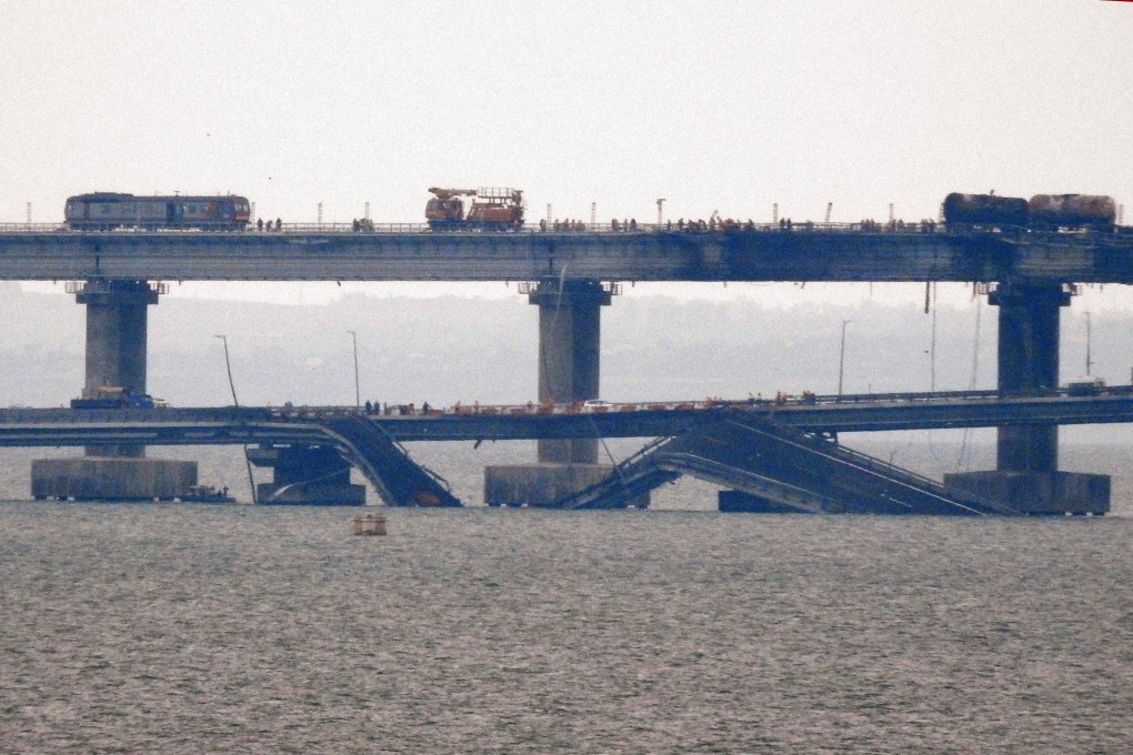 Workers restore the railway tracks on the Kerch bridge that links Crimea to Russia. Photo: AFP