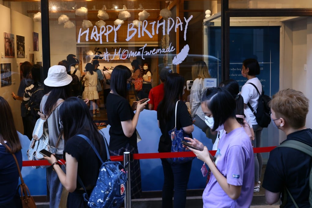 Well-wishers queue outside Still House boutique in Causeway Bay to leave messages of support for a dancer who suffered serious injuries during a concert by boy band Mirror. Photo: Dickson Lee.