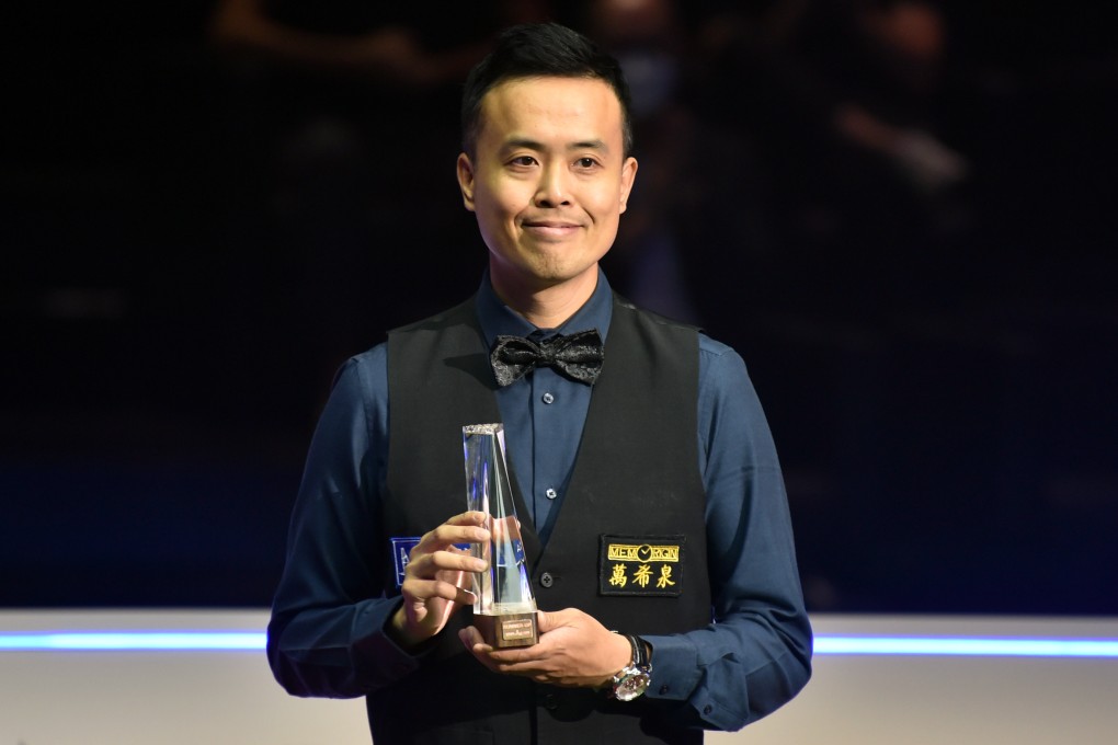 Marco Fu of Hong Kong celebrates with the trophy during the awarding ceremony of the Hong Kong Masters snooker tournament on Sunday. Photo: Xinhua