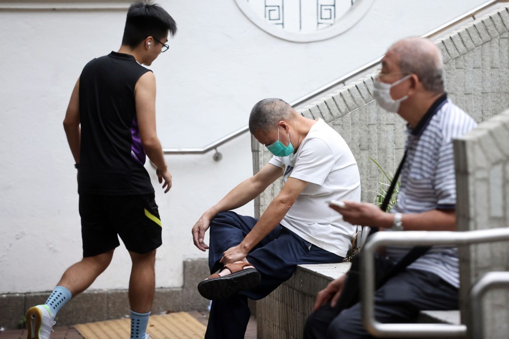 Elderly people sit on a bench while a younger man takes the stairs in a public garden in Jordan on October 10. Photo: K.Y. Cheng