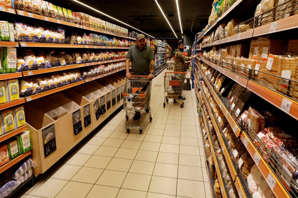 Ukrainian service members shop for groceries in Kramatorsk, Ukraine, on September 1. Ukraine’s military might be succeeding on the ground, but the country’s economy is struggling with high inflation and donors dallying in providing aid. Photo: Reuters