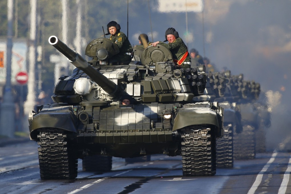 A column of Belarus army tanks take part in a rehearsal for the Independence Day military parade in Minsk in June 2016. Photo: AP