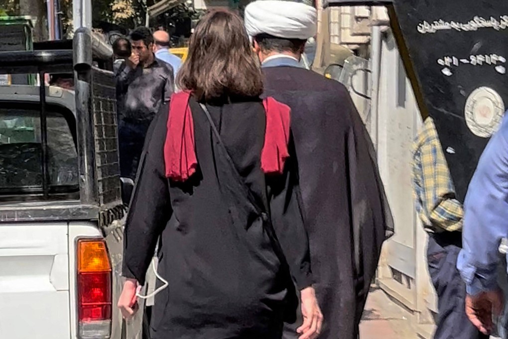 A picture obtained by AFP outside Iran shows a woman walking without a head scarf in the heart of the Iranian capital Tehran, on October 11, 2022. Photo: AFP