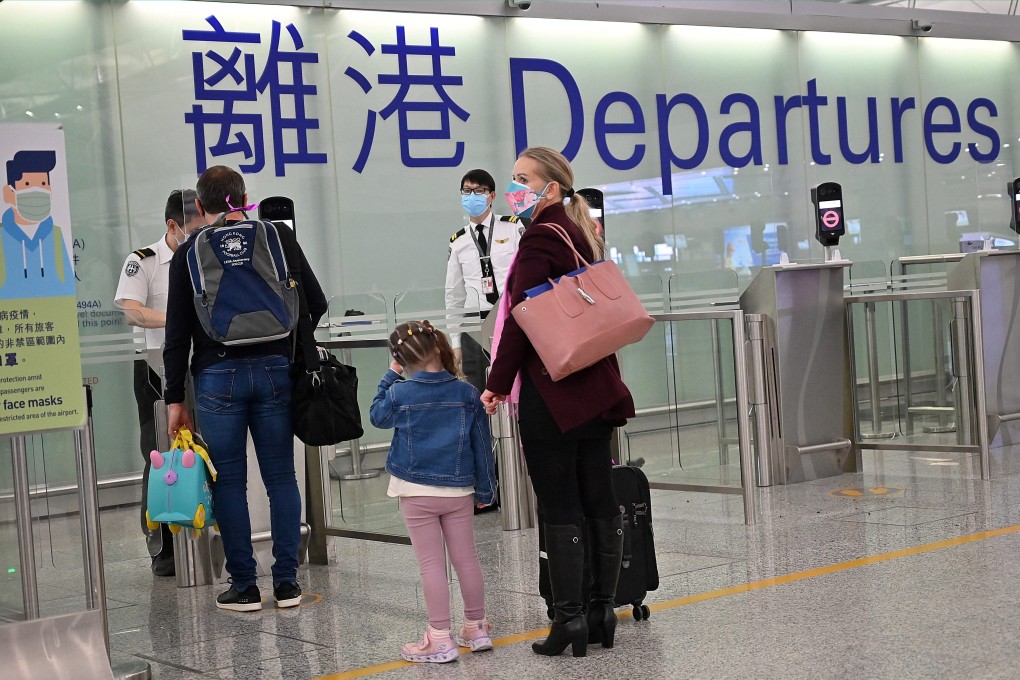 Expat familes depart Hong Kong’s Chek Lap Kok international airport. Photo: AFP