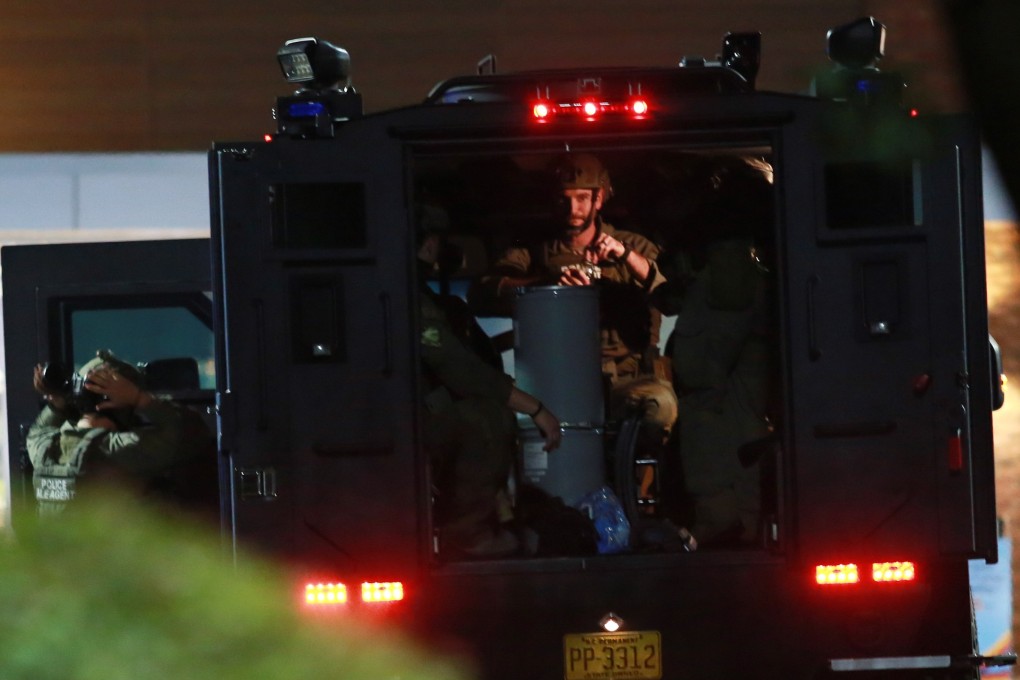 Heavily armed police officers respond to the shooting in Raleigh, North Carolina. Photo: EPA-EFE