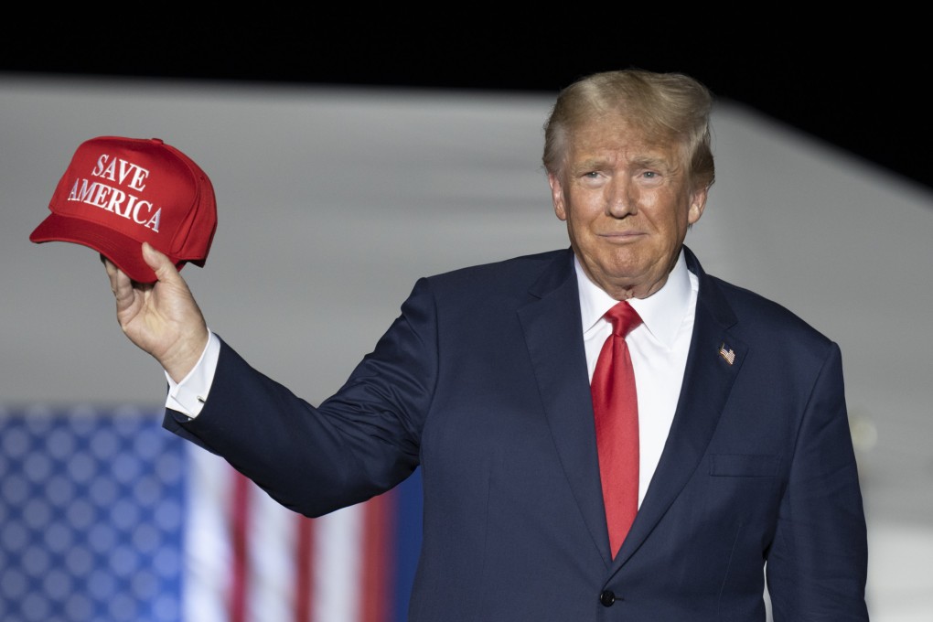Former US president Donald Trump makes his entrance at a rally at the Minden Tahoe Airport in Nevada on Saturday. Photo: AP