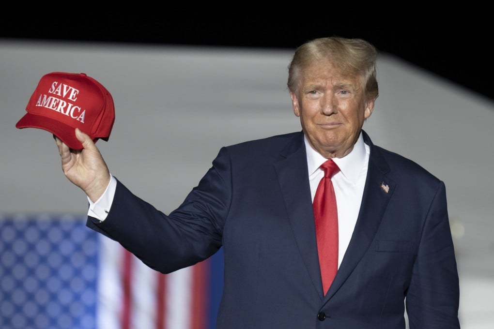 Former US president Donald Trump makes his entrance at a rally at the Minden Tahoe Airport in Nevada on Saturday. Photo: AP
